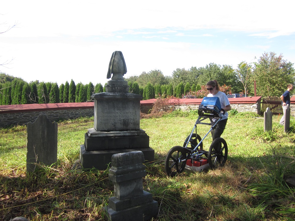 Emily Snyder using
          ground penetrating radar to detect lost graves