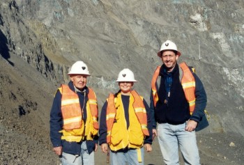 Dr. Kurt Friehauf with his dear friend Dr.
          Stacie Gibbins and Dr. Spence Titley in a rocky, plantless
          open mine pit. The Grasberg mine is located high in the
          mountains of West Papua, Indonesia.